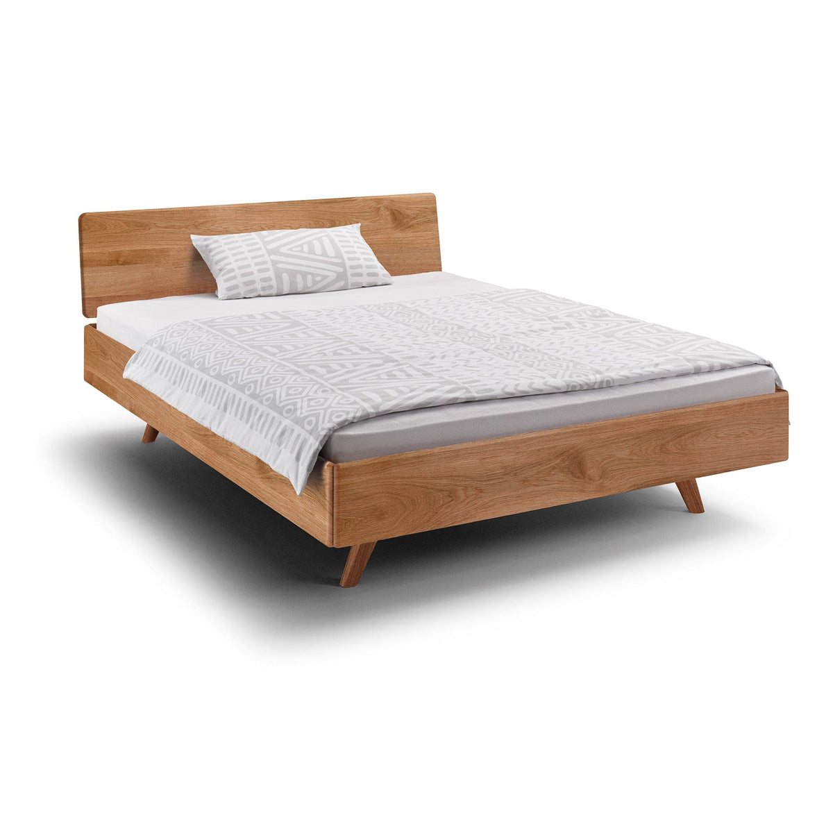 Holzmanufaktur Design Bett mit sanften Rundungen in massiver Eiche